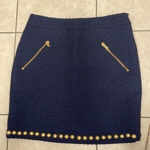Used Love Moschino Mini Skirt size 4. With gold studs and zipper details